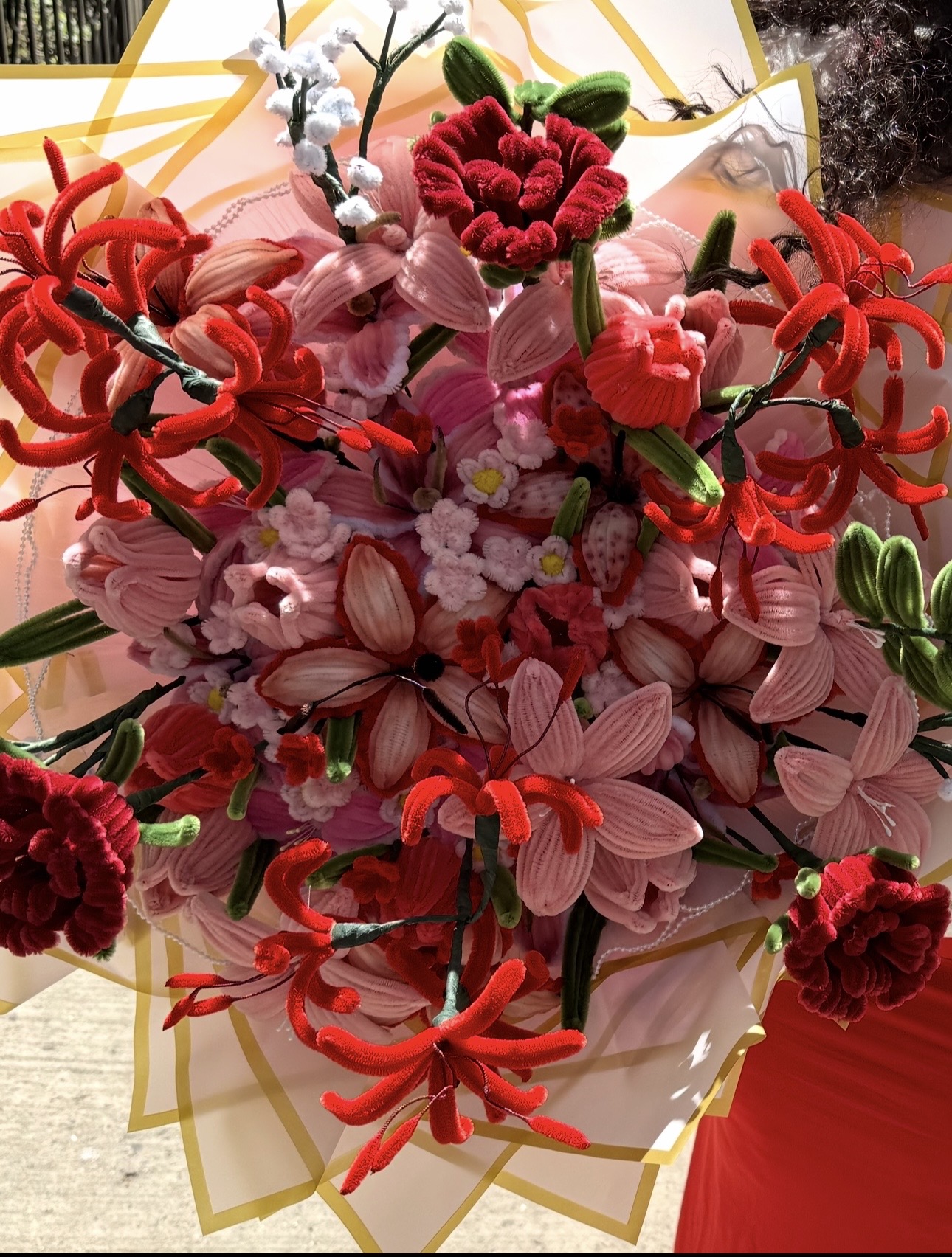 Mixed red and pink pipe cleaner bouquet with spider lilies and carnations